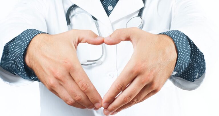 Doctor Holding His Hands In A Heart Shape