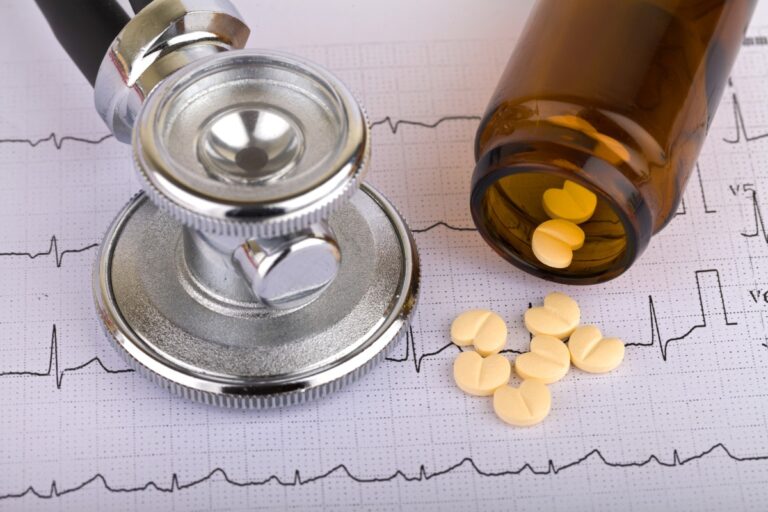 A Electrocardiogram, A Stethoscope, And Heart Shaped Pills