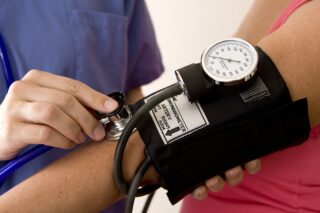 A Patient Having Their Blood Pressure Taken