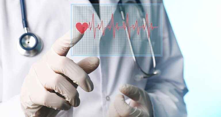 Doctor Pointing At An Electrocardiogram