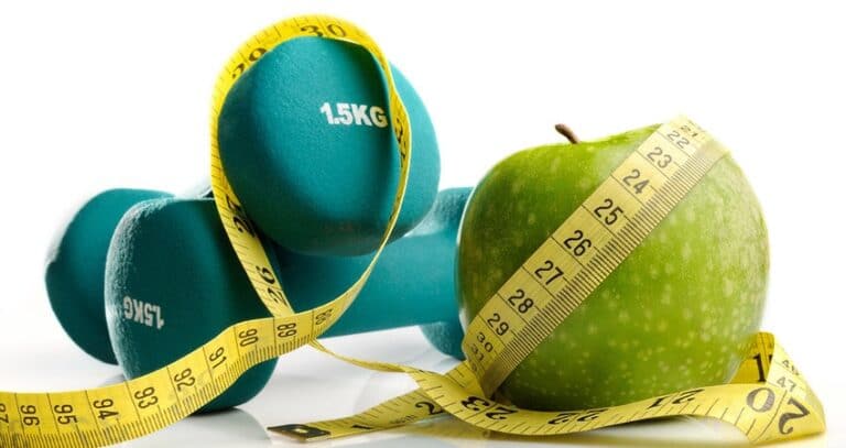 Tape Measure Weights And An Apple